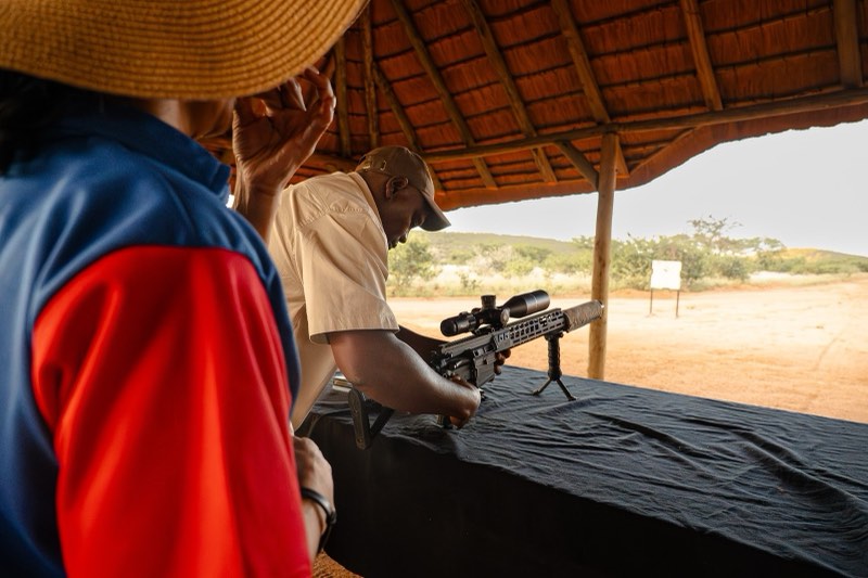 Range guide preparing firearms